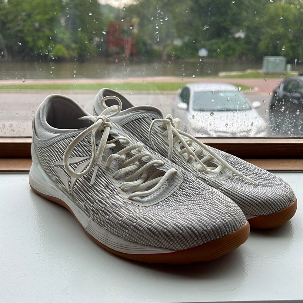 Reebok Nano white running shoes.